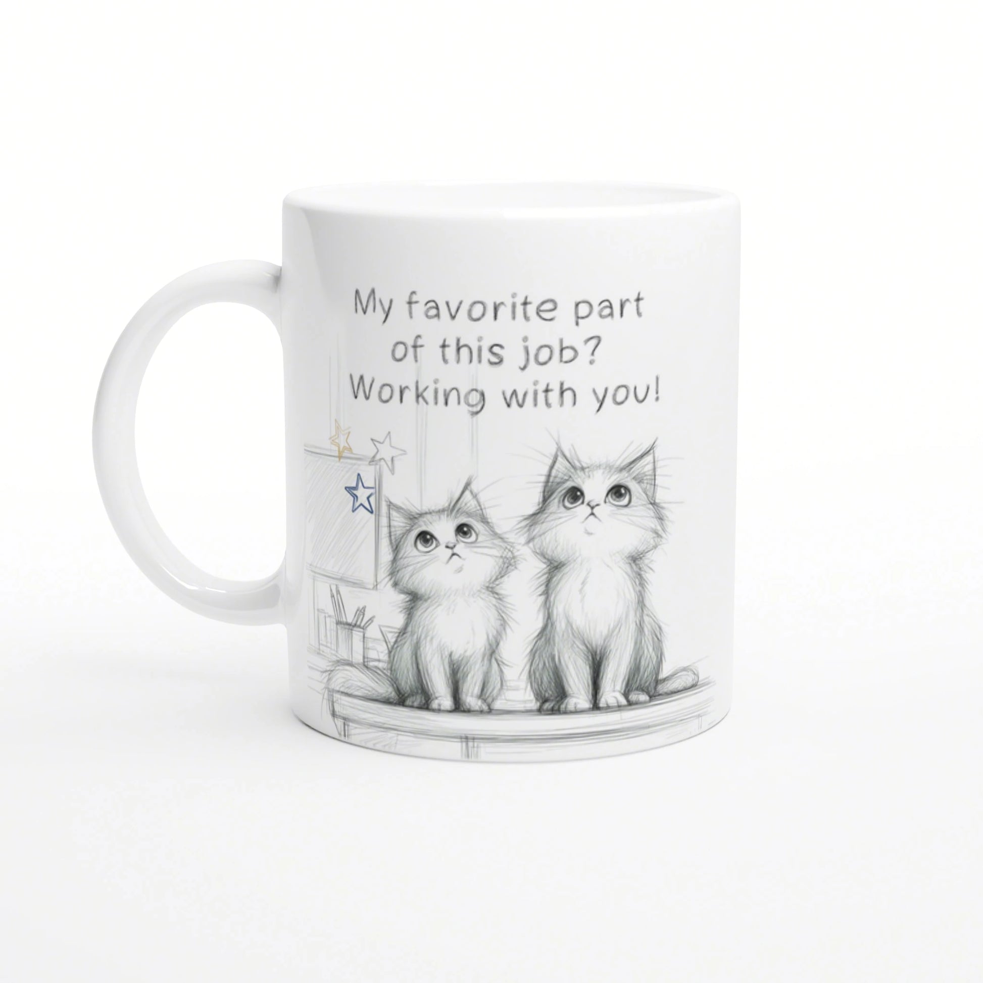 White mug featuring a pencil sketch of two kittens and the slogan 'My favorite part of this job? Working with you!'