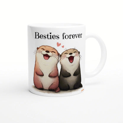 White mug with a cute illustration of two laughing otters and the caption 'Besties forever' above them.