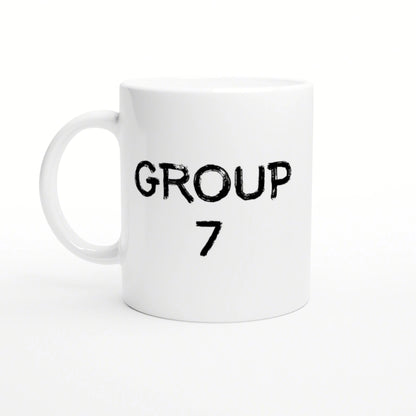 White ceramic mug featuring two-line black distressed text: 'GROUP' on top and '7' below, on a plain white studio background.