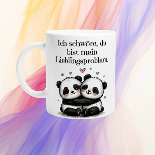 White mug mockup with two hugging pandas and the German caption: 'Ich schwöre, du bist mein Lieblingsproblem.' background.