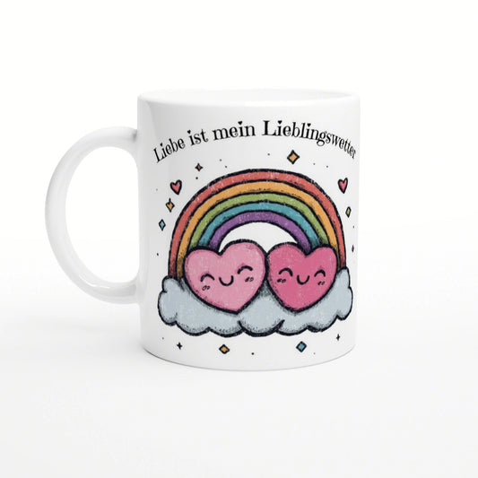 White mug mockup with two pink hearts on a cloud under a rainbow and the German slogan Liebe ist mein Lieblingswetter.