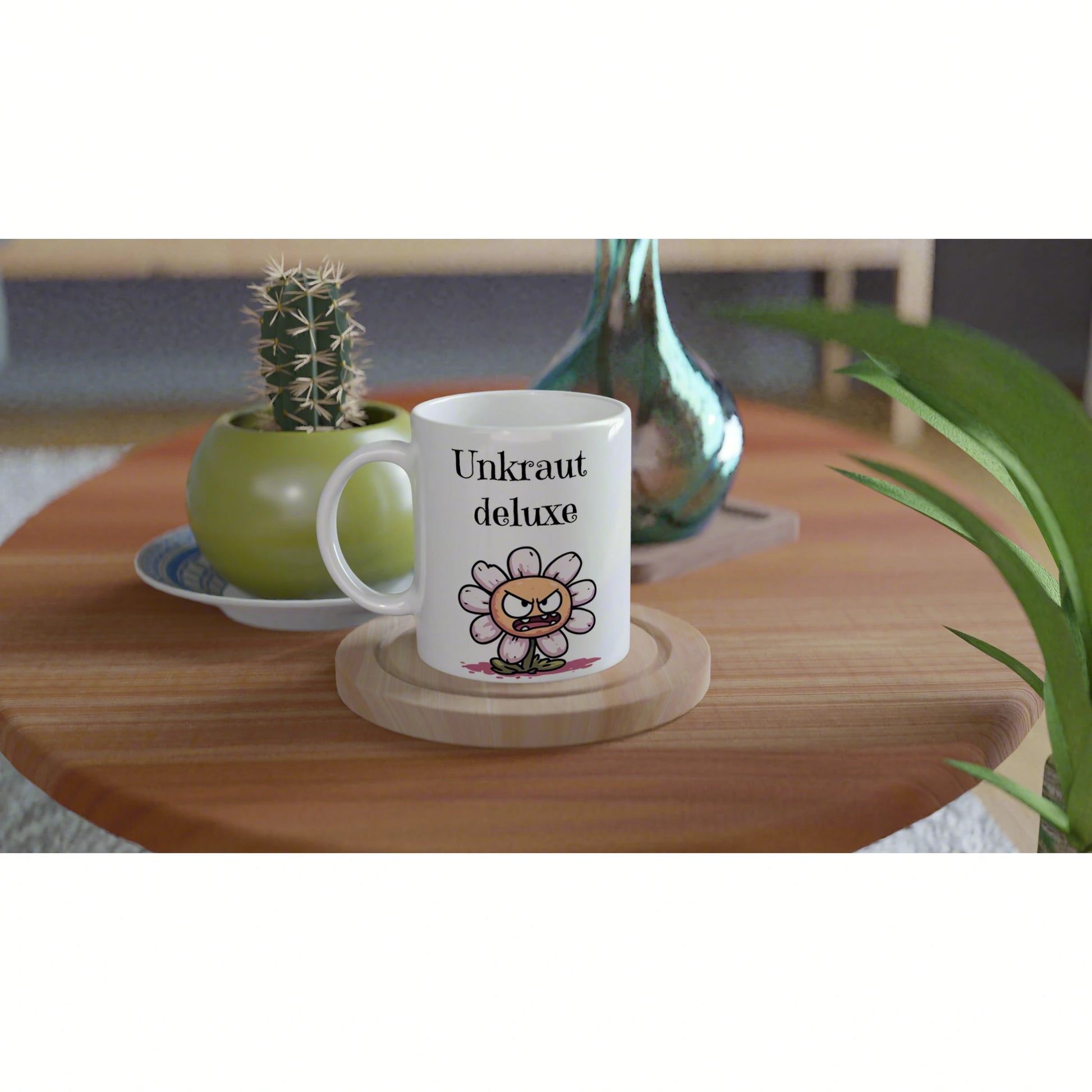 White mug with Unkraut deluxe and a cartoon angry flower, on a wooden table, shown as a product mockup for an online shop.
