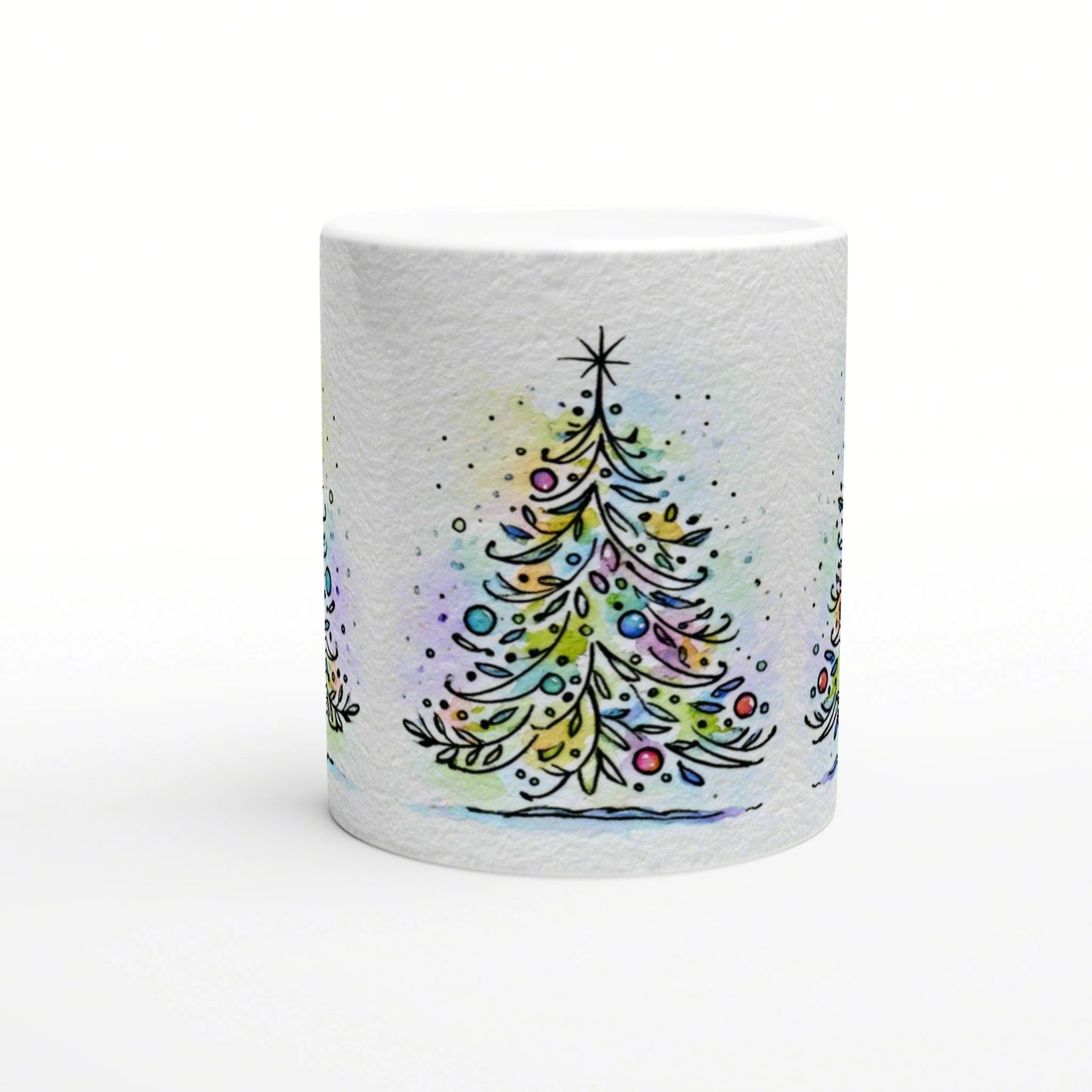 White mug featuring a watercolor-style Christmas tree with colorful ornaments and a star on top.