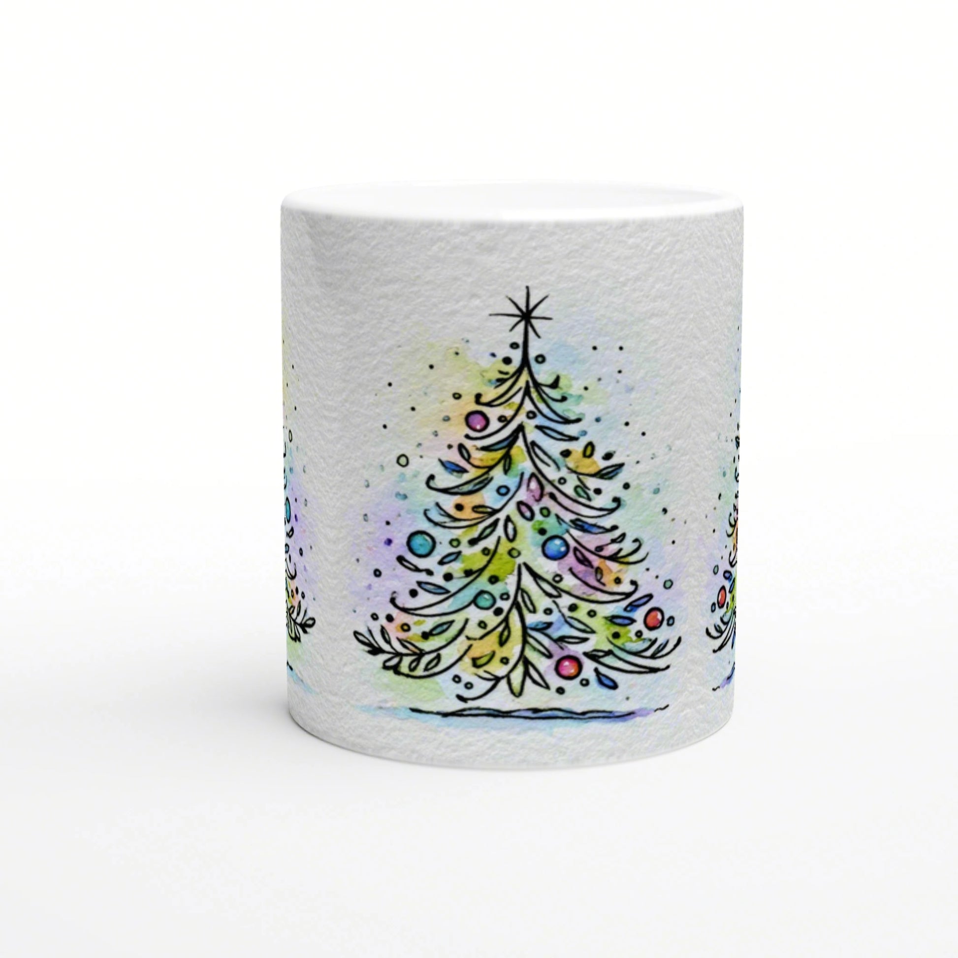 White mug featuring a watercolor-style Christmas tree with colorful ornaments and a star on top.