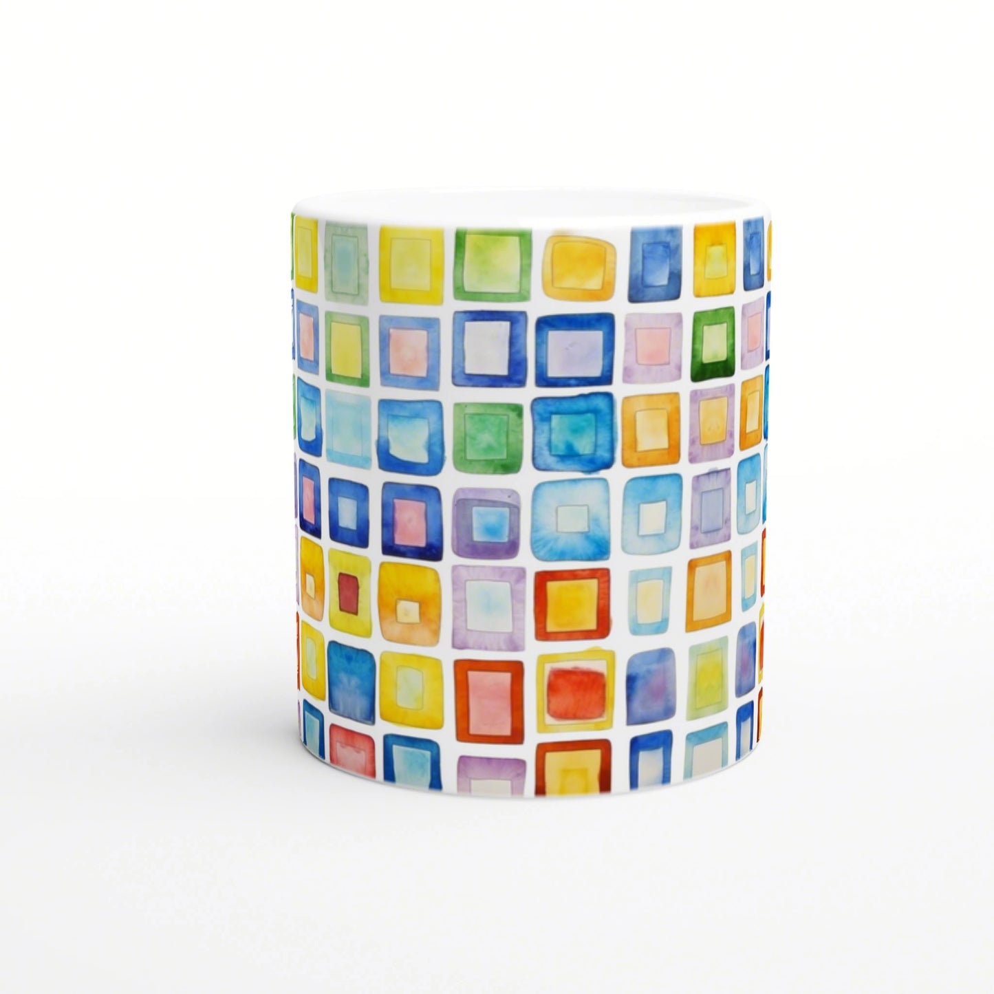 White mug featuring a watercolor mosaic of colorful squares in rainbow hues.