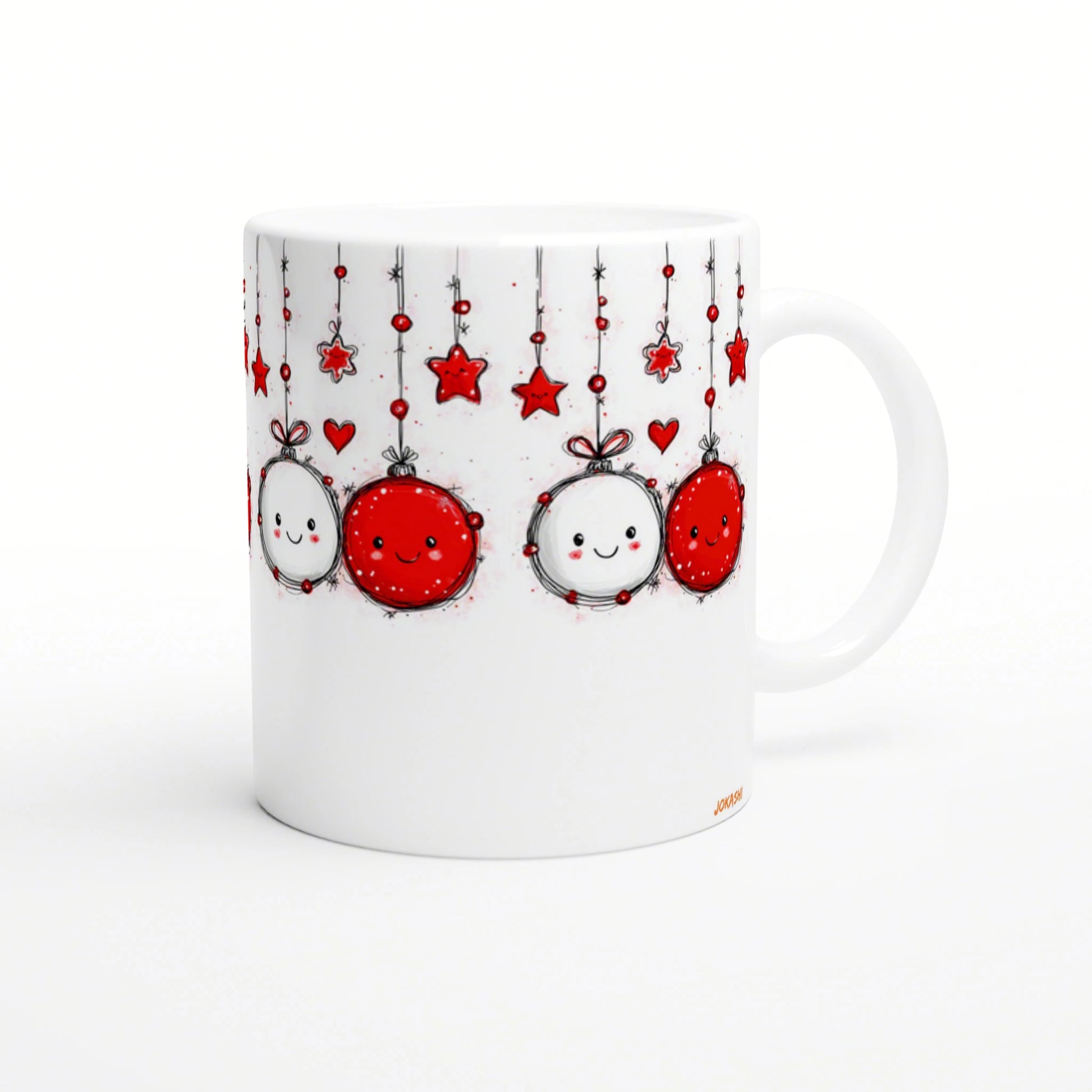 White mug featuring a whimsical doodle-style design of hanging red-and-white ornaments with smiling faces, stars, and hearts.