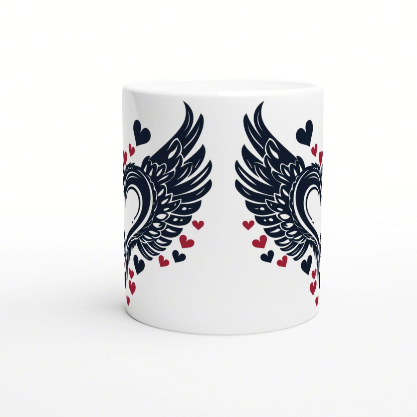 White ceramic mug mockup with bold black wings mirrored on each side and scattered red and navy hearts.
