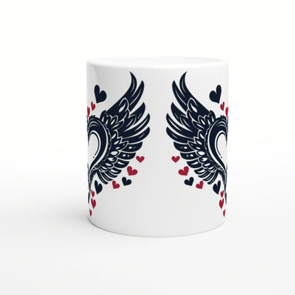 White ceramic mug mockup with bold black wings mirrored on each side and scattered red and navy hearts.