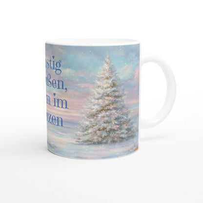 White mug with winter scene: snow-covered Christmas tree against pastel sky and falling snow, with blue text on the left.